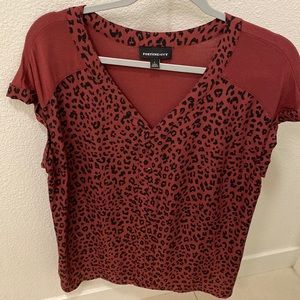 Red animal print blouse . Never worn